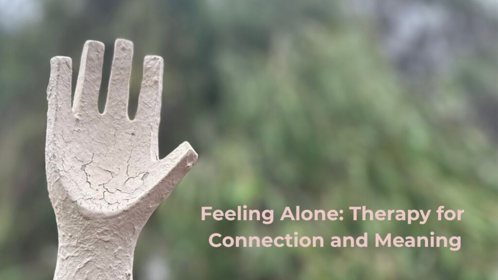 Hand reaching toward blurred tree—symbolizing therapy for loneliness and connection in Perth